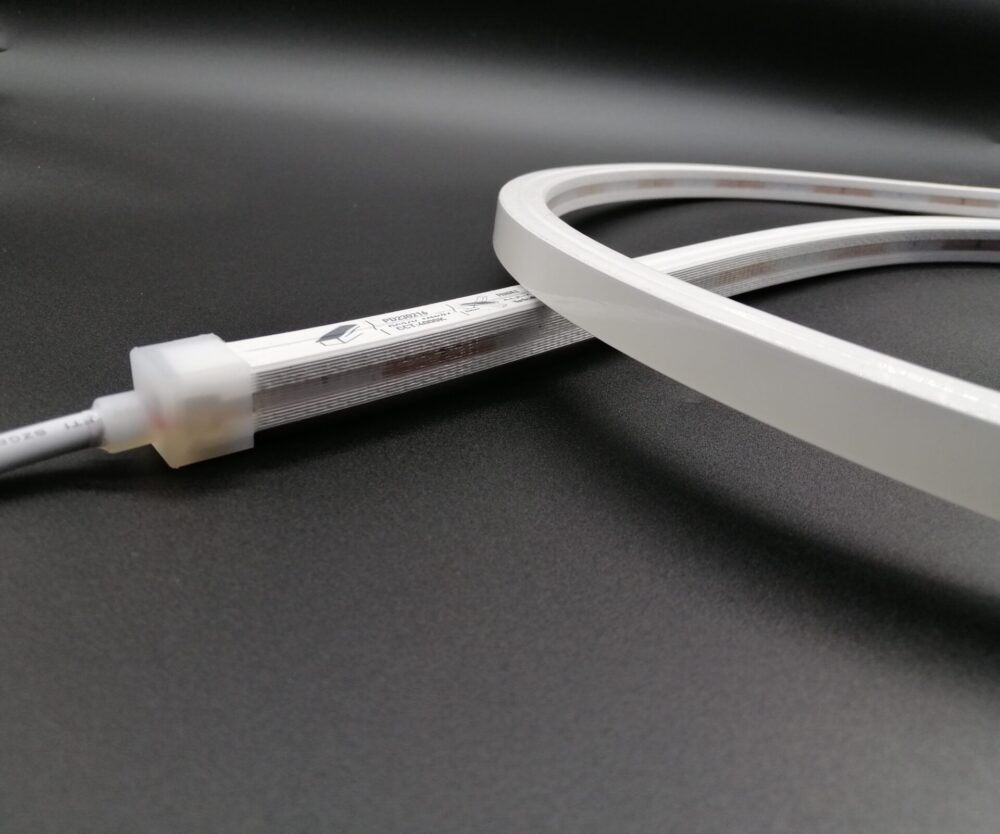 Close-up of unlit 12x12mm top bend neon flex LED strip with connector