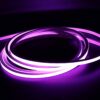 Purple illuminated neon flex LED strip coiled in dark environment